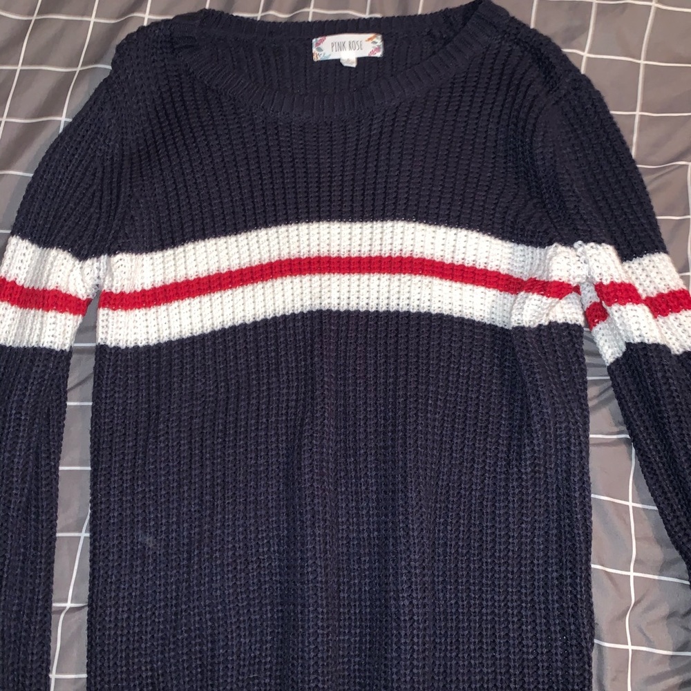 Navy blue sweater with white and red stripes